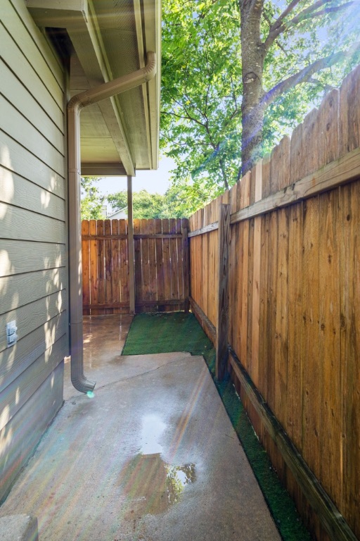 8703 Schick Road, Unit A Austin, TX 78729 - Photo 20 of 21 a view of a backyard with wooden fence