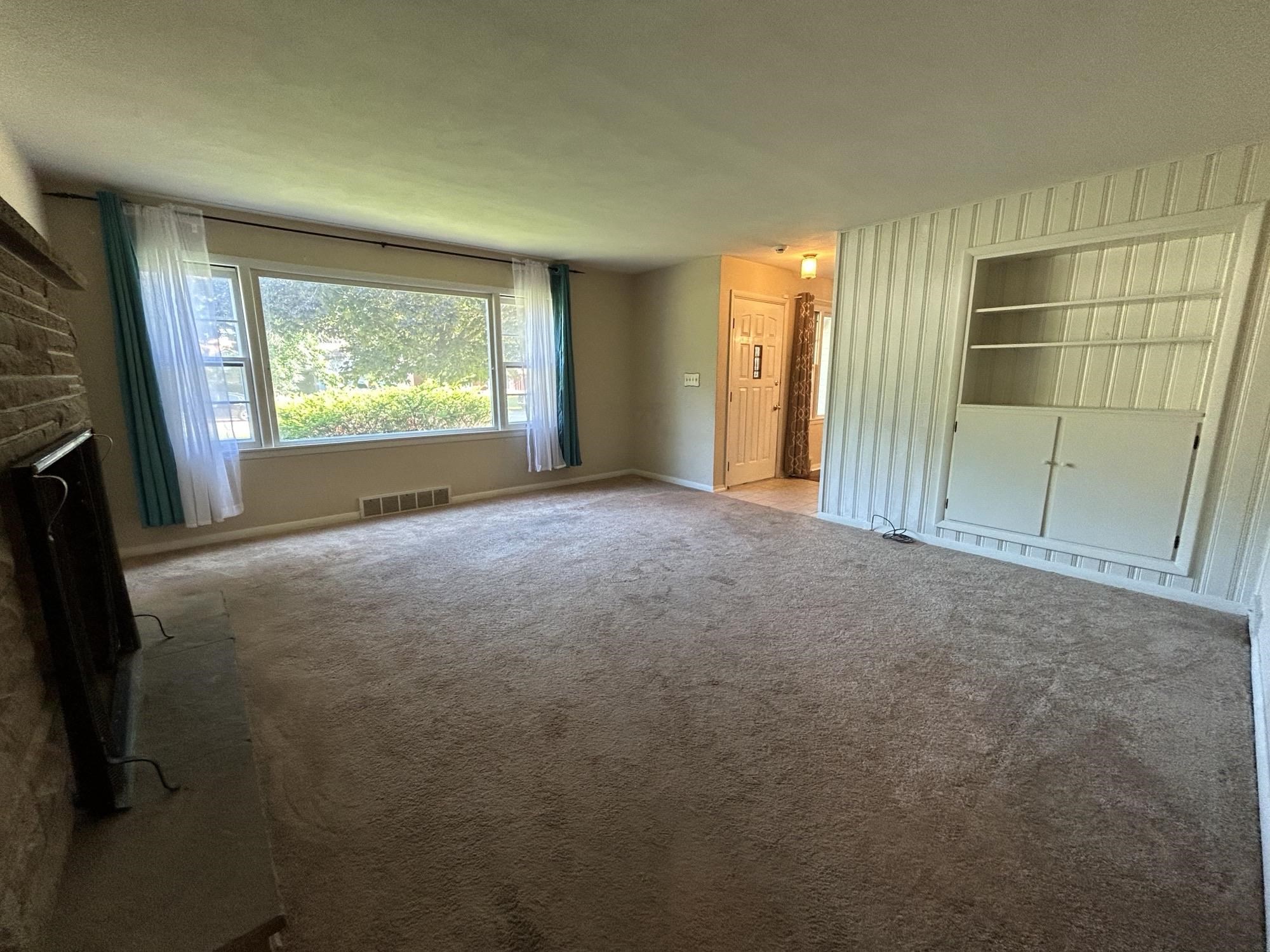 4003 Pinecrest Road Rockford, IL 61107 - Photo 4 of 16 a view of an empty room with a window