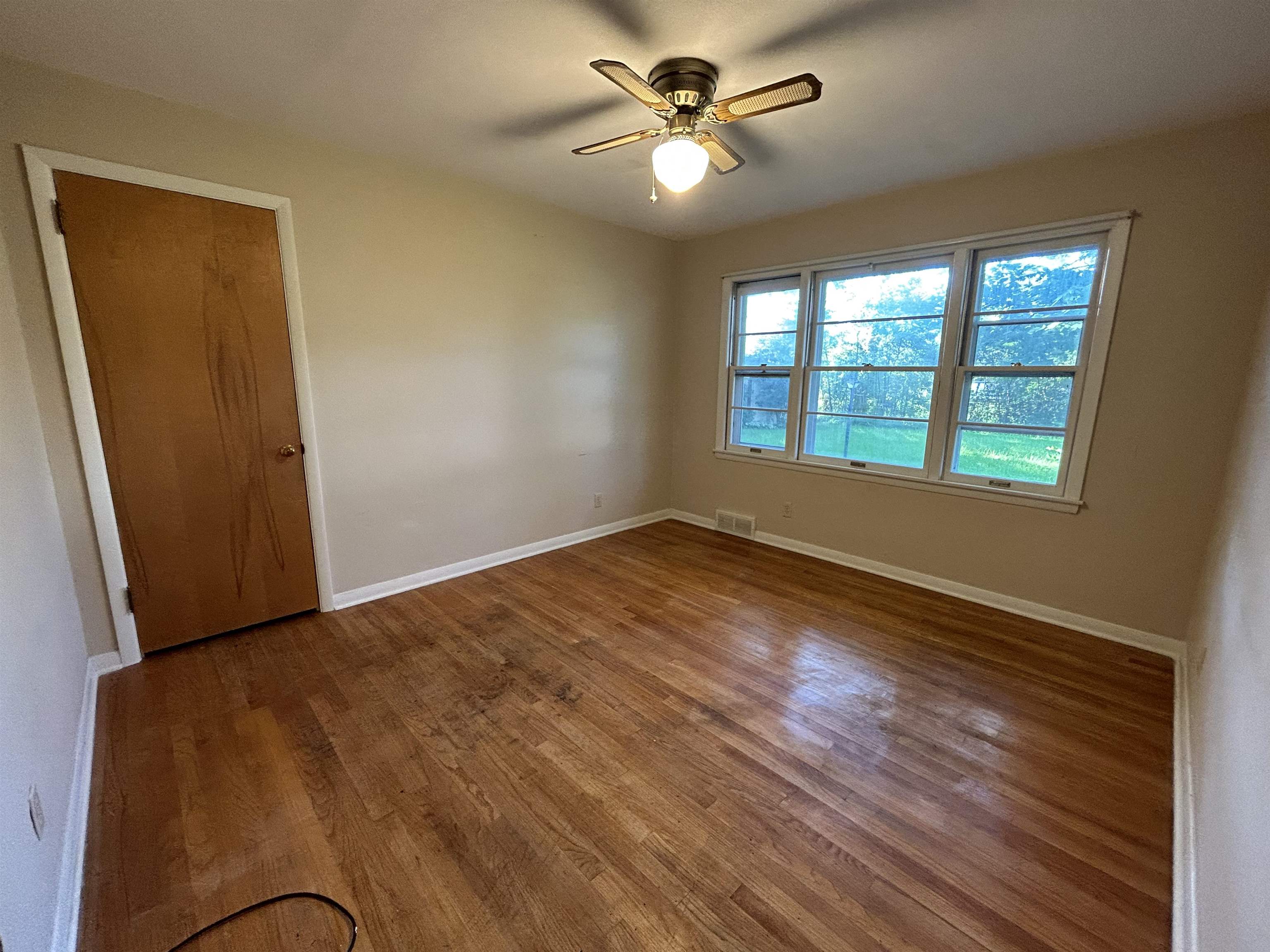 4003 Pinecrest Road Rockford, IL 61107 - Photo 9 of 16 a view of an empty room with a window