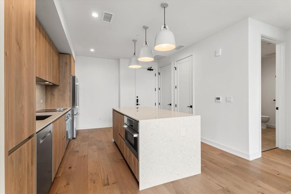 84 East Avenue, Unit 1202 Austin, TX 78701 - Photo 2 of 39 a view of a kitchen with electric appliances