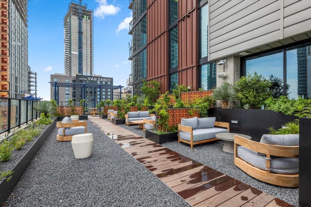 84 East Avenue, Unit 1202 Austin, TX 78701 - Photo 23 of 39 a view of a patio with couches table and chairs and potted plants