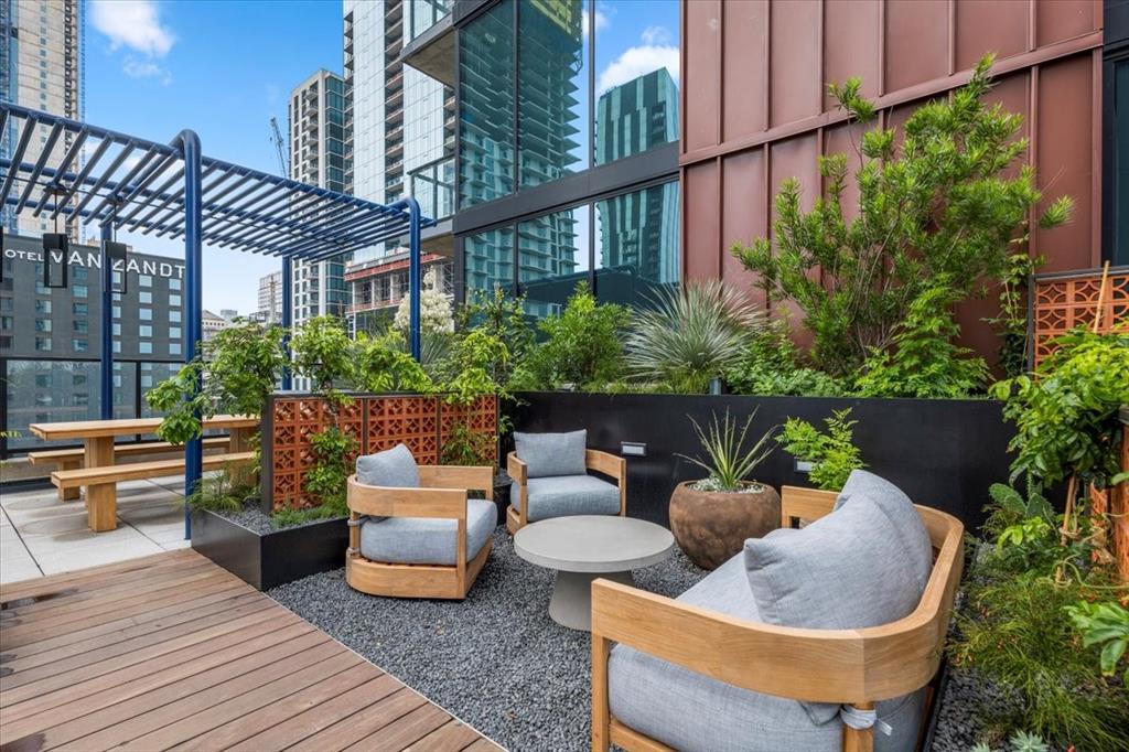84 East Avenue, Unit 1202 Austin, TX 78701 - Photo 24 of 39 a building outdoor space with patio furniture and potted plants