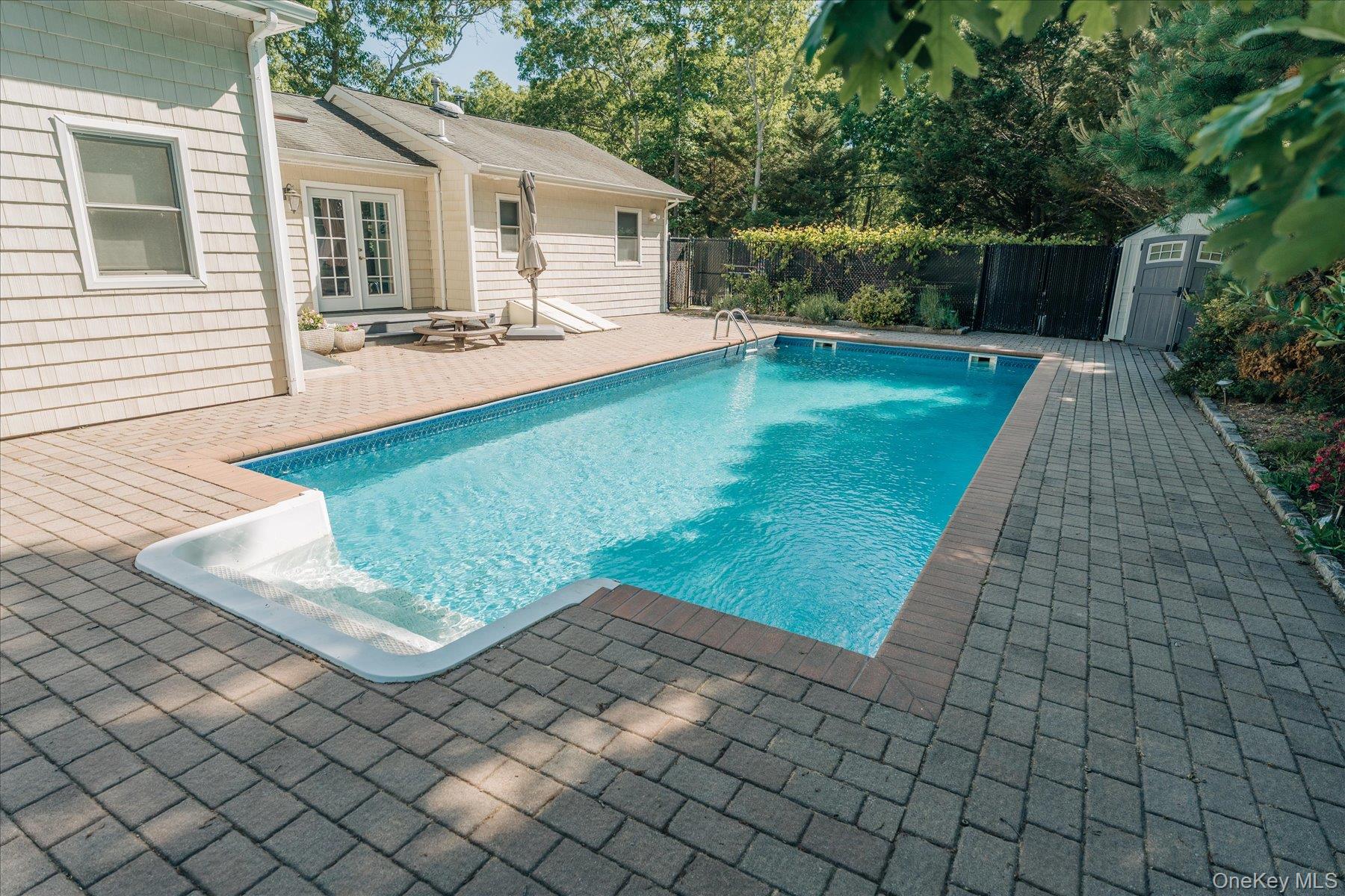 32 Red Creek Road Hampton Bays, NY 11946 - Photo 18 of 18 a front view of house with yard patio and yard