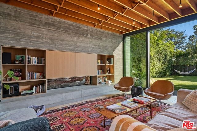 a view of a patio with couches and potted plants