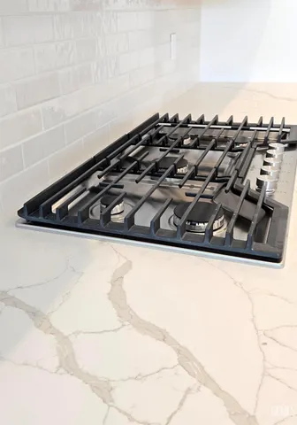 a close up of a stove top oven sitting on a floor