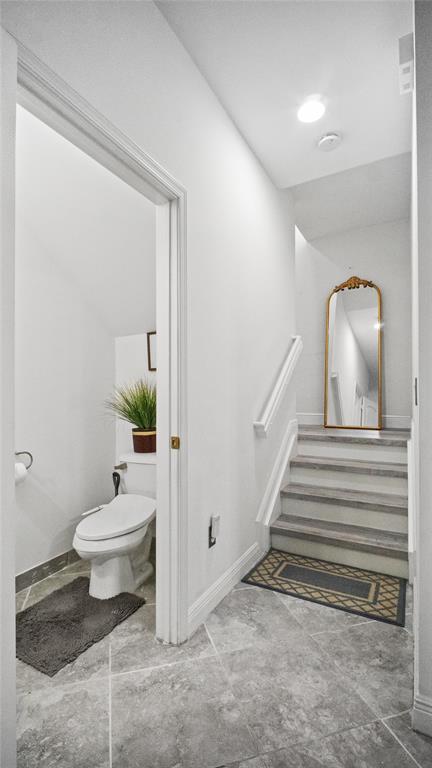 6993 Pines Circle, Unit 6993 Pompano Beach, FL 33073 - Photo 17 of 33 a bathroom with a toilet sink and shower