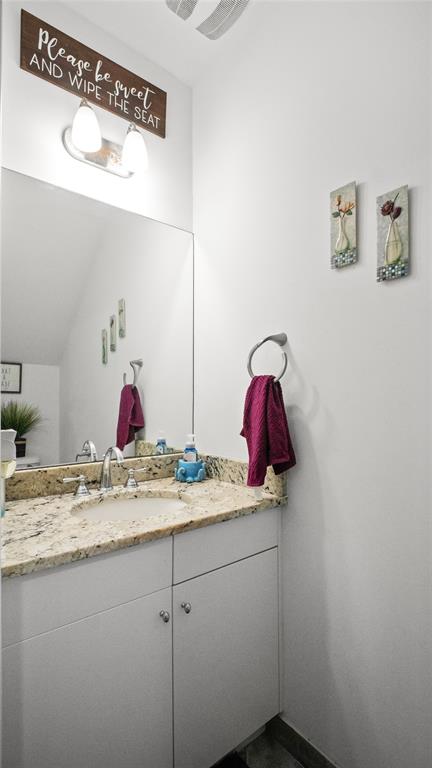 6993 Pines Circle, Unit 6993 Pompano Beach, FL 33073 - Photo 18 of 33 a bathroom with a granite countertop sink and a mirror