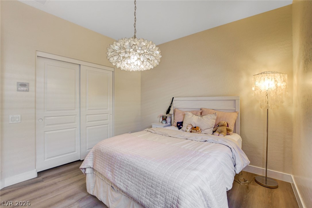 2649 Rue Marquette Avenue Henderson, NV 89044 - Photo 31 of 55 This tranquil sleeping space features a distinctive overhead light fixture and convenient sliding closet doors.