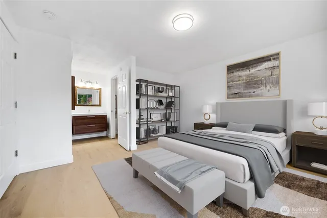 a spacious bedroom with a bed and walk in closet