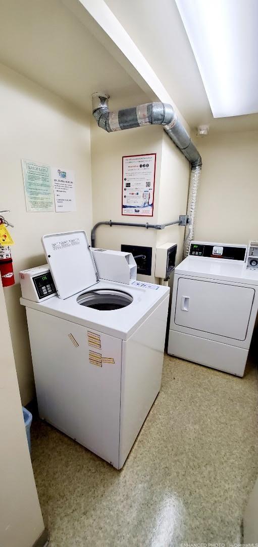 440 Seaside Avenue, Unit 702 Honolulu, HI 96815 - Photo 13 of 14 a living room with furniture and a flat screen tv
