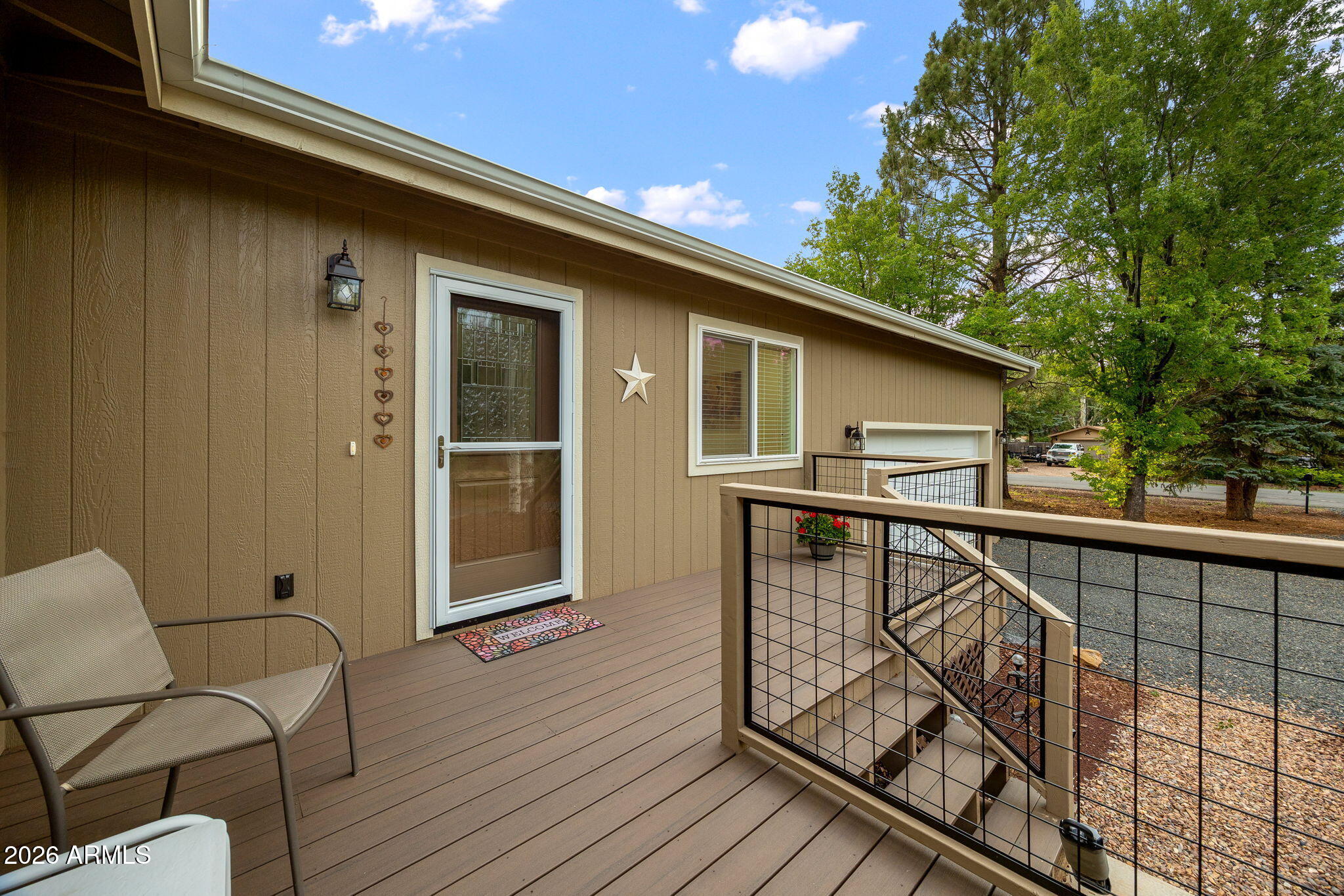 5145 Drifting Snow Loop Pinetop, AZ 85935 - Photo 3 of 37 a balcony with wooden floor in front of it