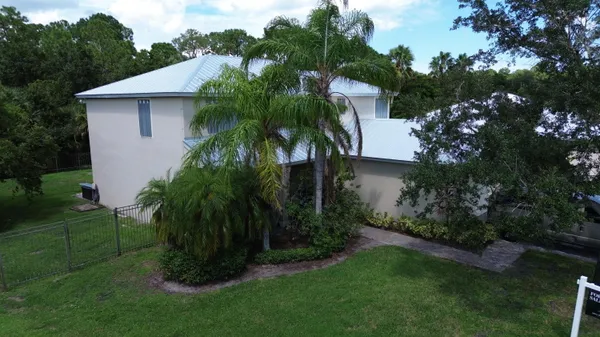 a view of a house with a garden back yard