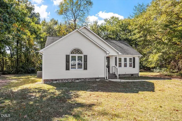 a view of a house with snow on the side of it