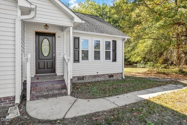 a view of a house with brick walls