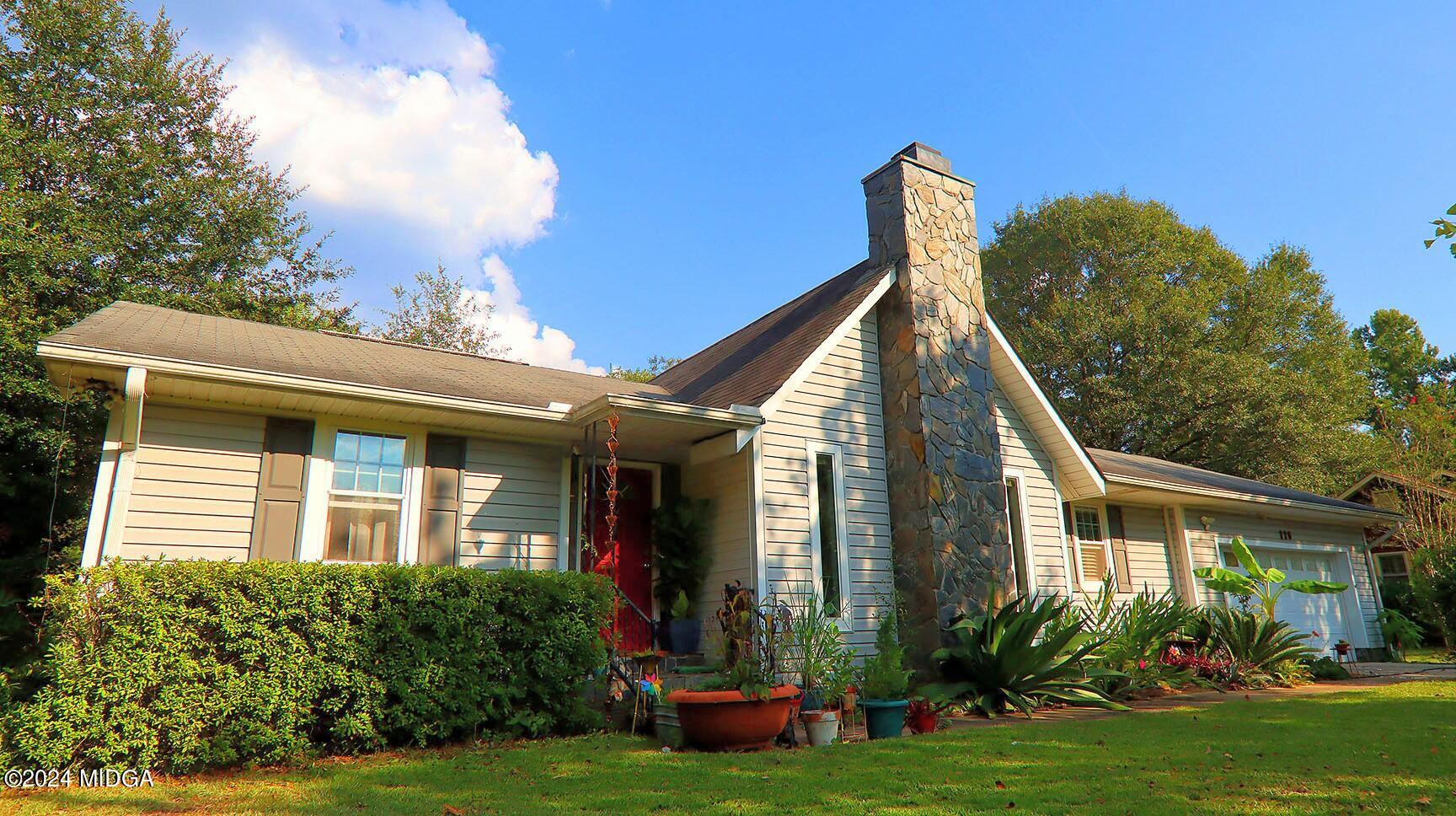 116 Coley Lake Road Macon, GA 31216 - Photo 3 of 22 a front view of a house with garden