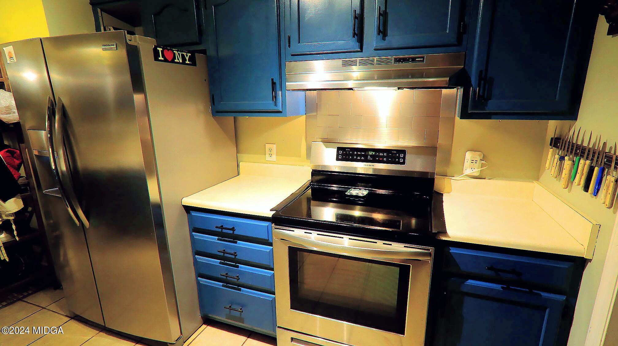 116 Coley Lake Road Macon, GA 31216 - Photo 7 of 22 a kitchen with a stove and a refrigerator