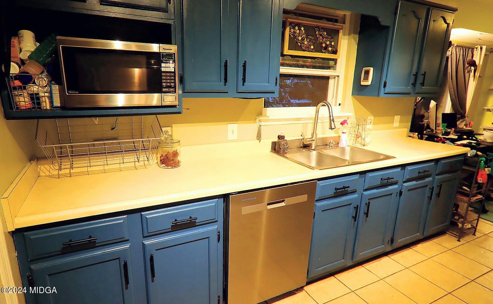116 Coley Lake Road Macon, GA 31216 - Photo 8 of 22 a kitchen with a sink and cabinets