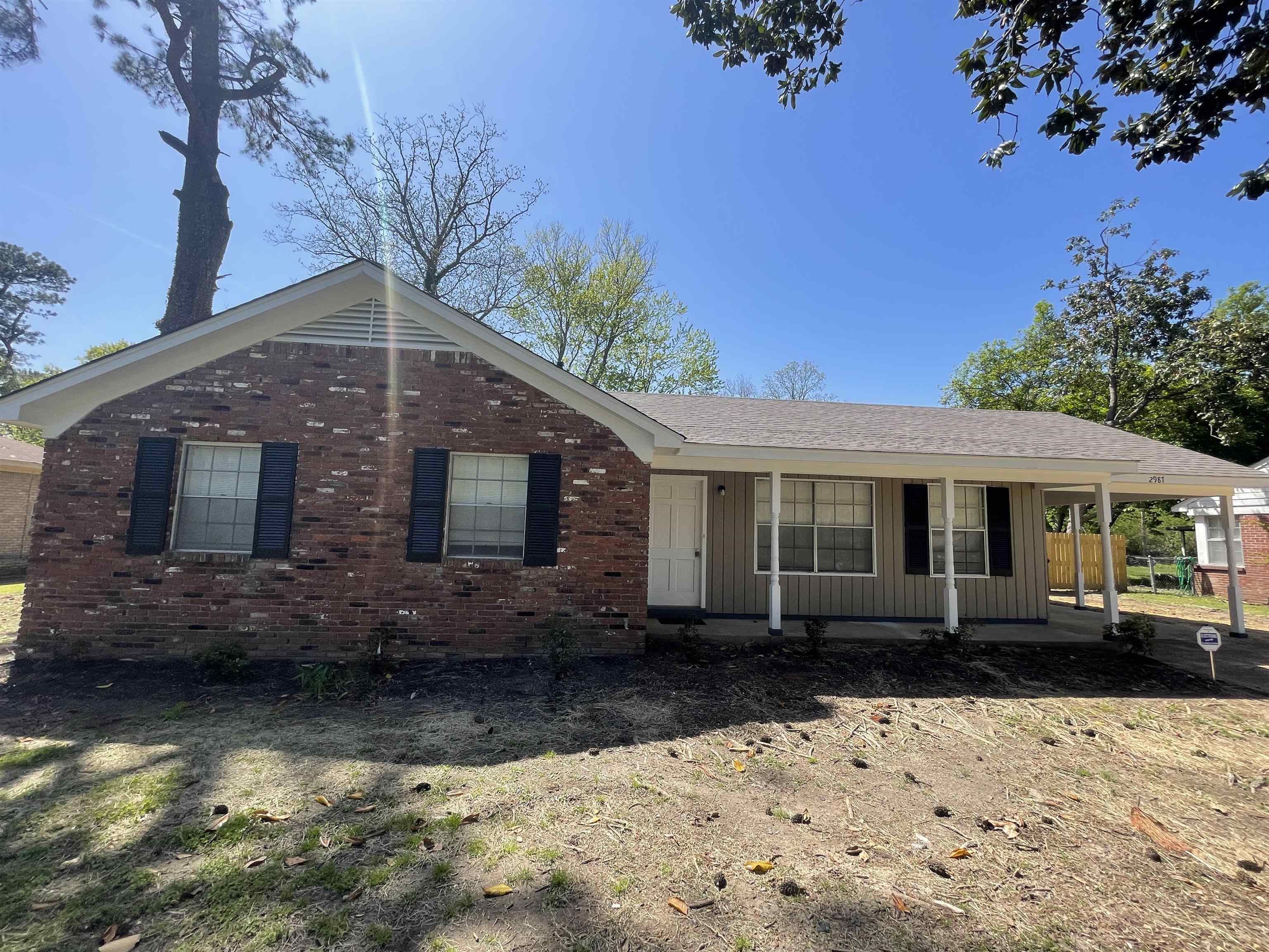 a front view of a house with yard
