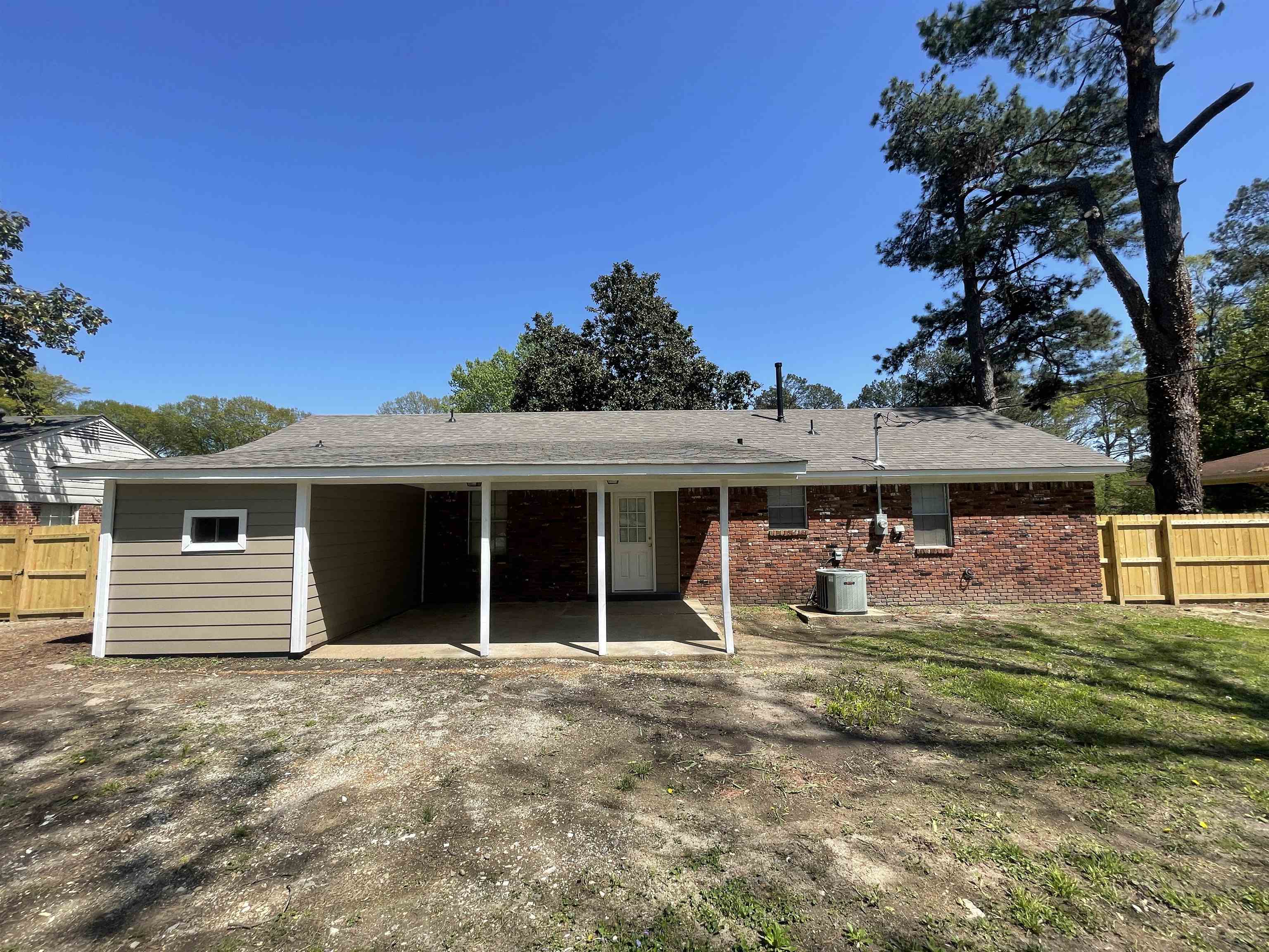 2987 Ruskin Road Bartlett, TN 38134 - Photo 12 of 12 front view of a house with a big yard