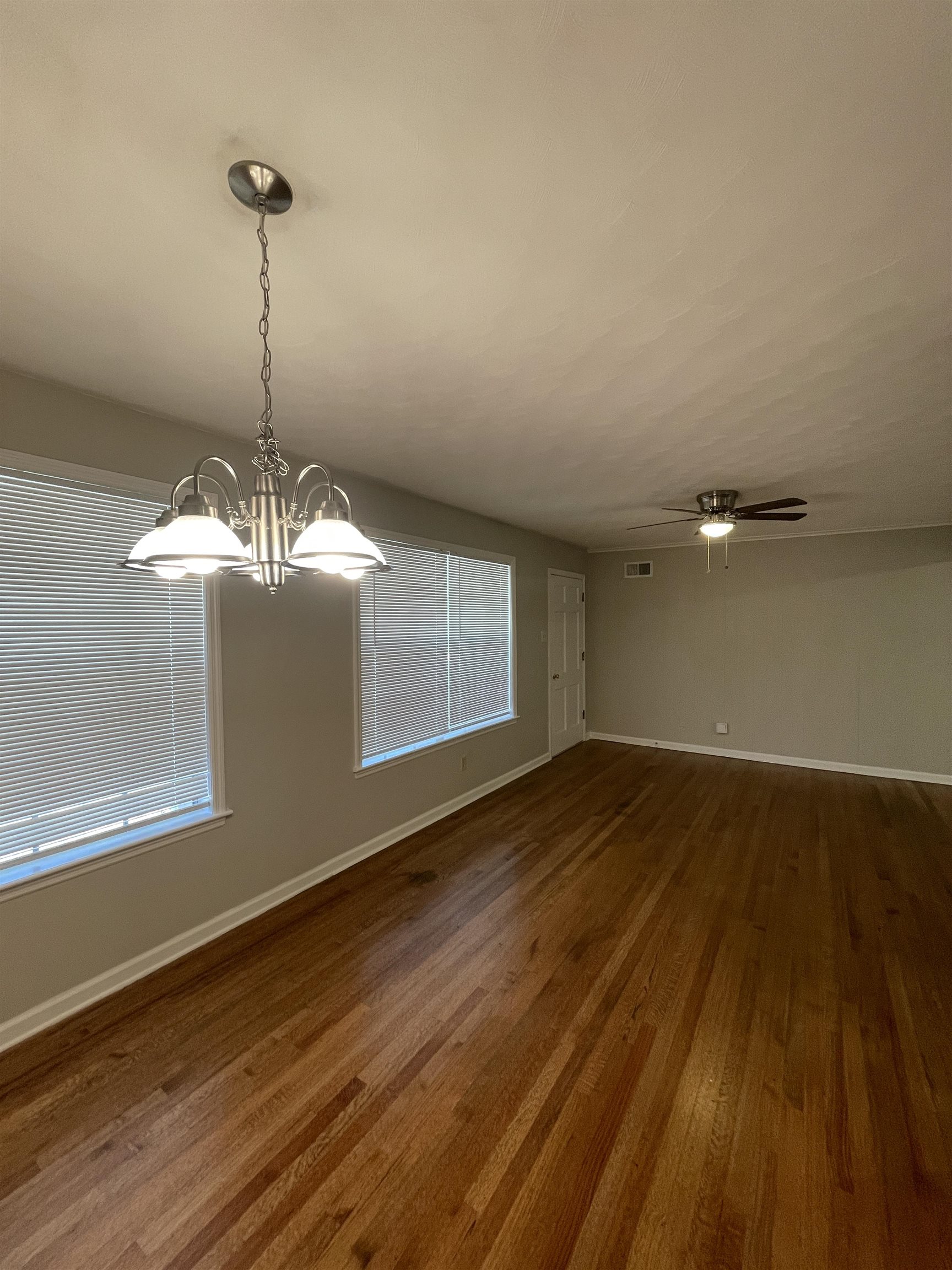 2987 Ruskin Road Bartlett, TN 38134 - Photo 2 of 12 a view of a room with wooden floor and white walls