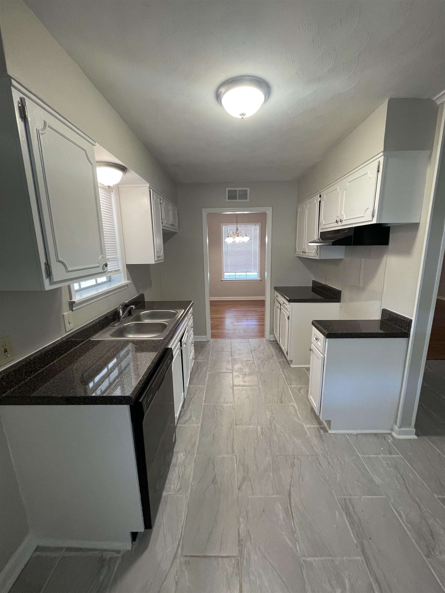 2987 Ruskin Road Bartlett, TN 38134 - Photo 5 of 12 a kitchen with stainless steel appliances granite countertop a stove a sink and a refrigerator