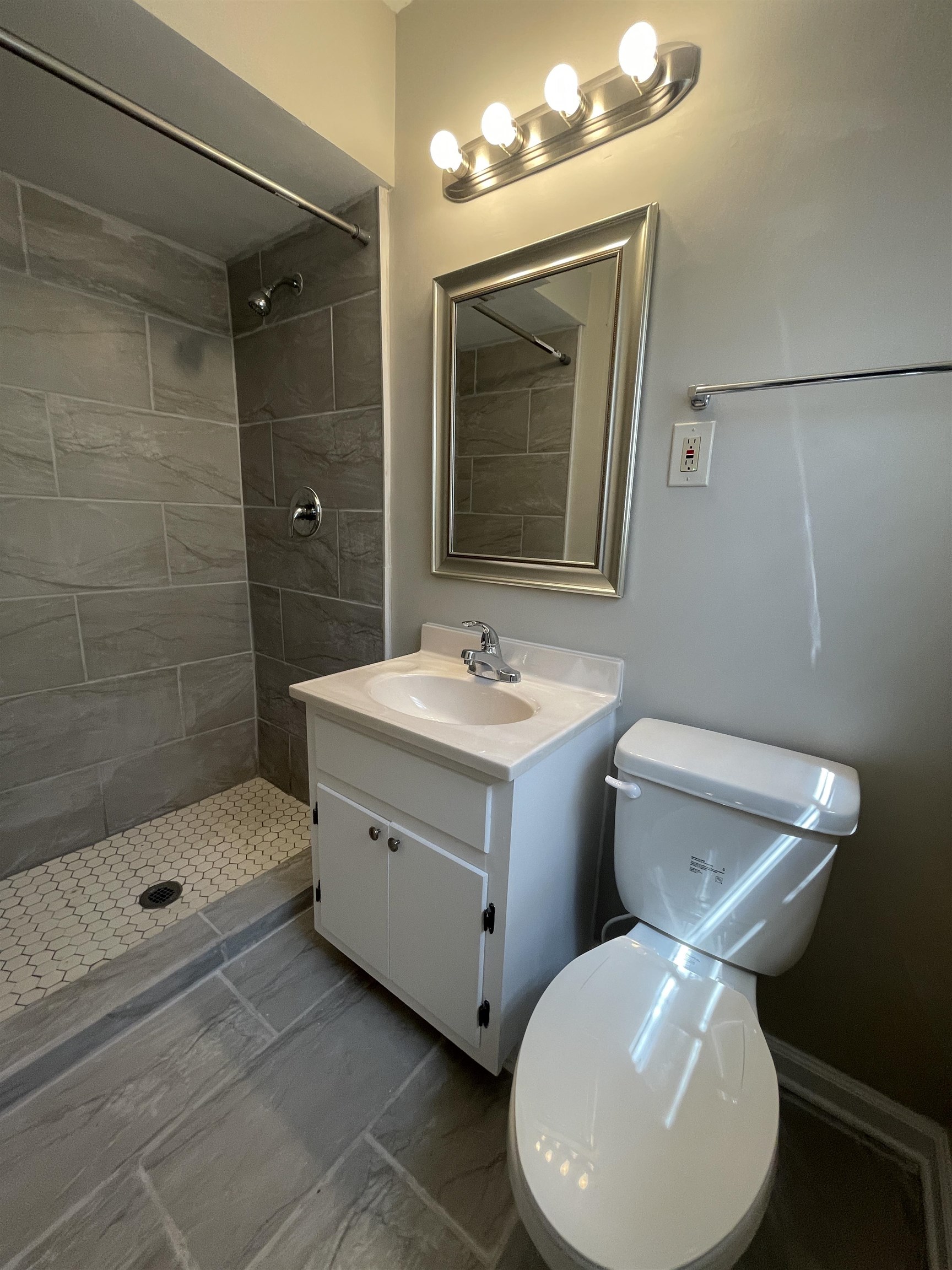 2987 Ruskin Road Bartlett, TN 38134 - Photo 7 of 12 a bathroom with a sink mirror and toilet