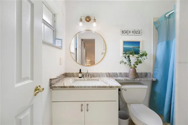 a bedroom with furniture and window