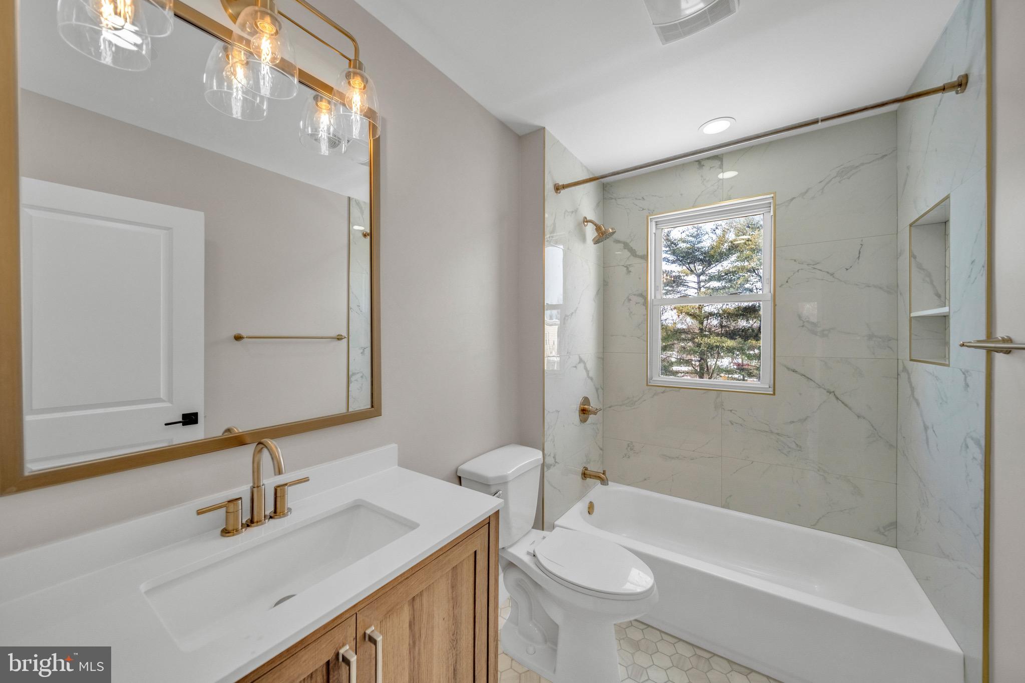 6018 2nd Street Northwest Washington, DC 20011 - Photo 13 of 18 a bathroom with a sink toilet a mirror and shower