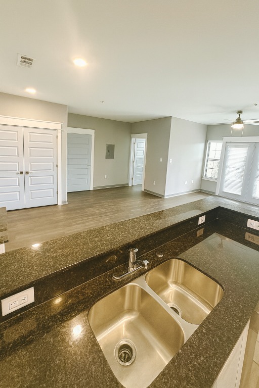 200 Maple Lane, Unit 1201 Elgin, TX 78621 - Photo 23 of 23 a bathroom with a granite countertop sink and bathtub