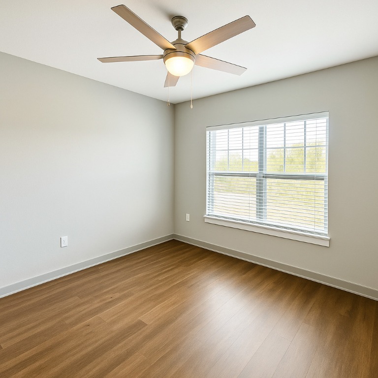 200 Maple Lane, Unit 1201 Elgin, TX 78621 - Photo 18 of 23 an empty room with wooden floor and windows