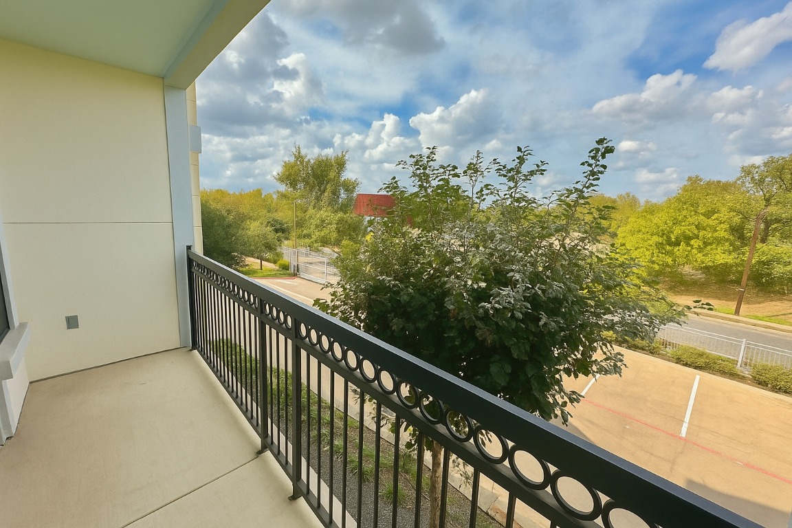 200 Maple Lane, Unit 1201 Elgin, TX 78621 - Photo 20 of 23 a view of a balcony with flower plants