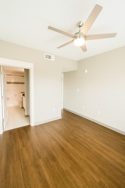 200 Maple Lane, Unit 1201 Elgin, TX 78621 - Photo 6 of 23 wooden floor in an empty room