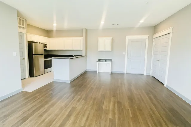 a view of a balcony with flower plants