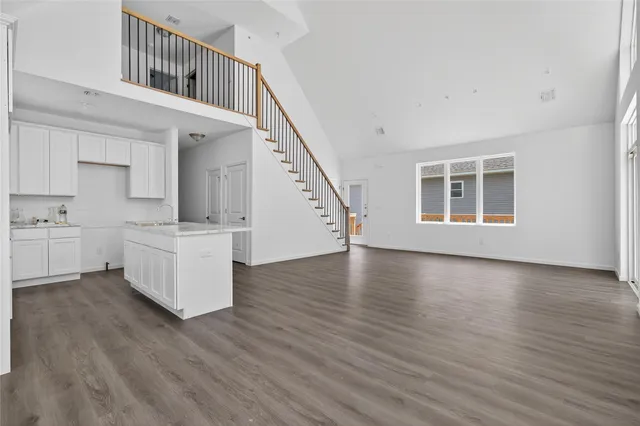 a view of kitchen with furniture and wooden floor