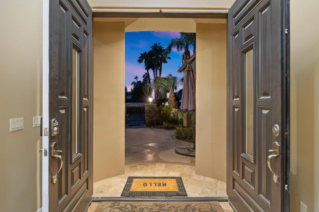 a dining room with wooden floor and windows