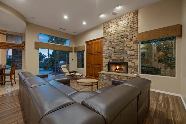 a view of a workspace with furniture wooden floor and window