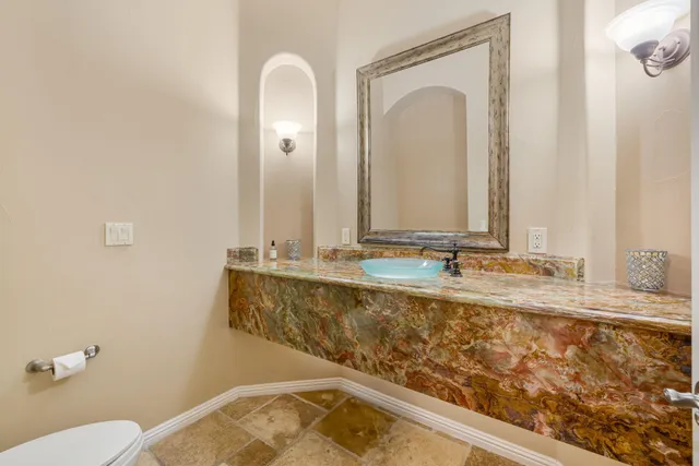 a view of a lush green hillside and houses