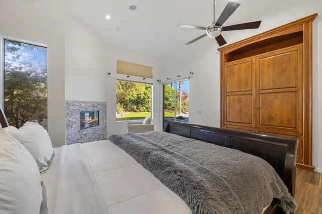 a view of a swimming pool with an outdoor seating and mountain view
