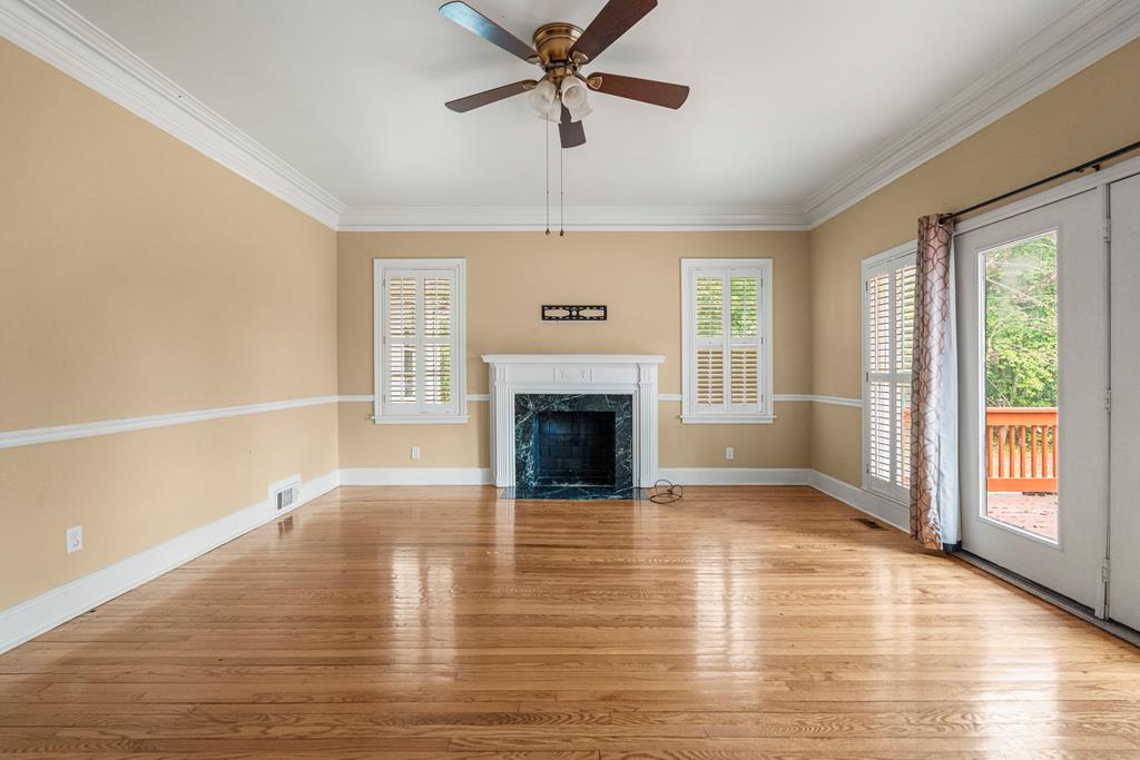 1500 Preston Drive Columbus, GA 31906 - Photo 3 of 29 a view of an empty room with window and wooden floor