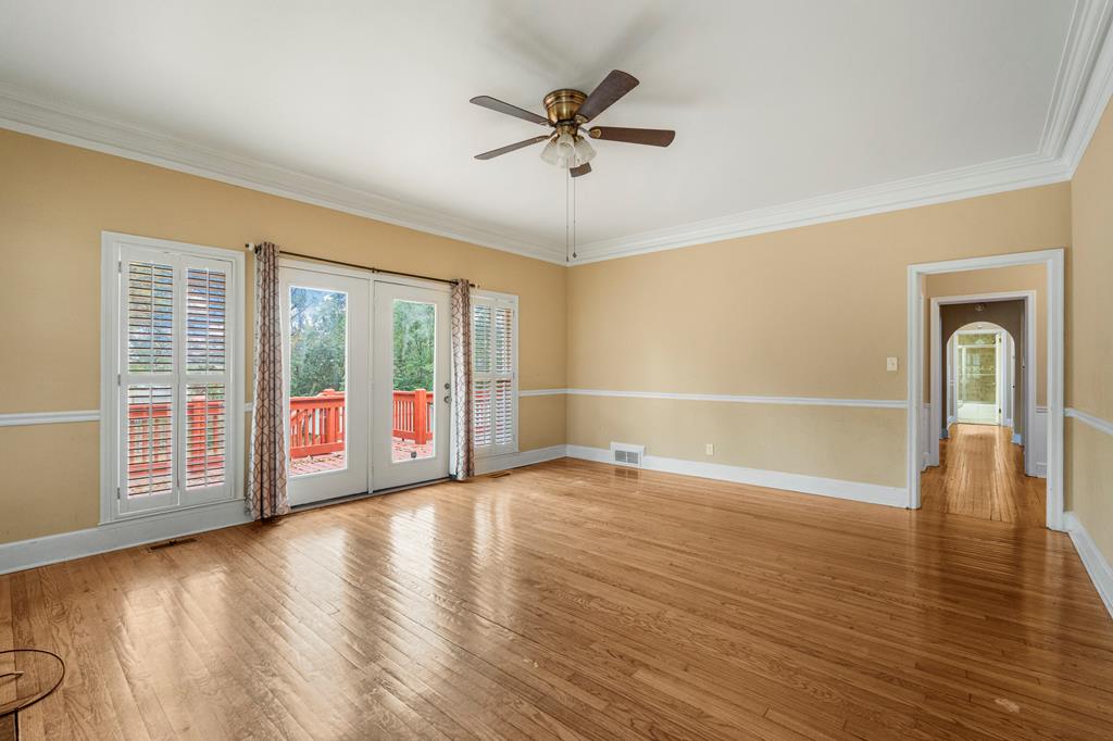 1500 Preston Drive Columbus, GA 31906 - Photo 5 of 29 a view of an empty room with a window and wooden floor