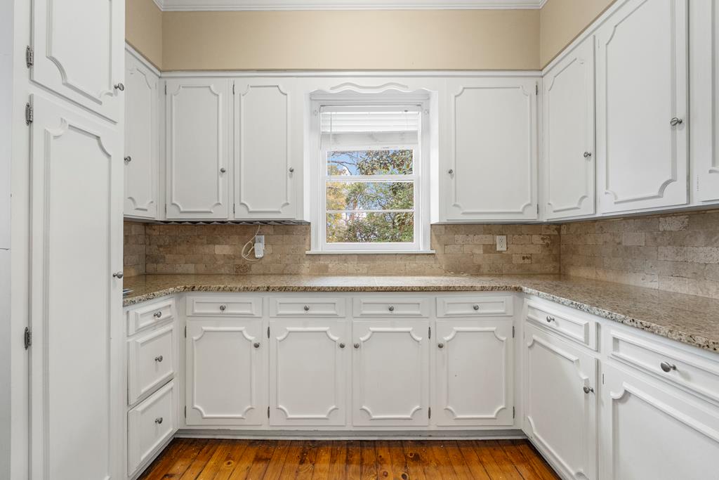 1500 Preston Drive Columbus, GA 31906 - Photo 6 of 29 a kitchen with white cabinets and white appliances