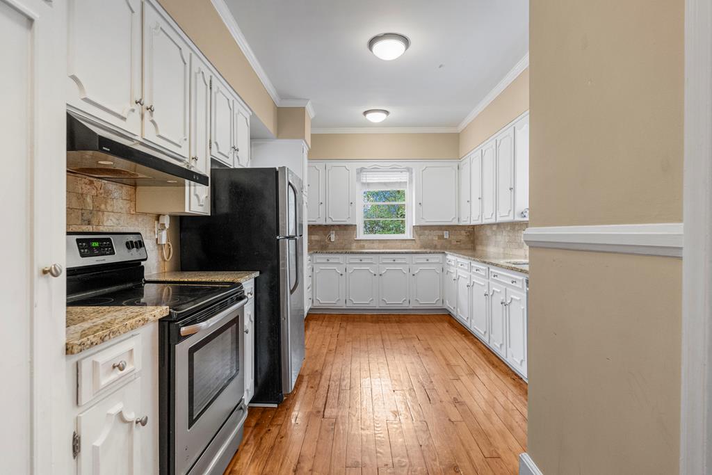1500 Preston Drive Columbus, GA 31906 - Photo 9 of 29 a kitchen with a refrigerator stove and microwave
