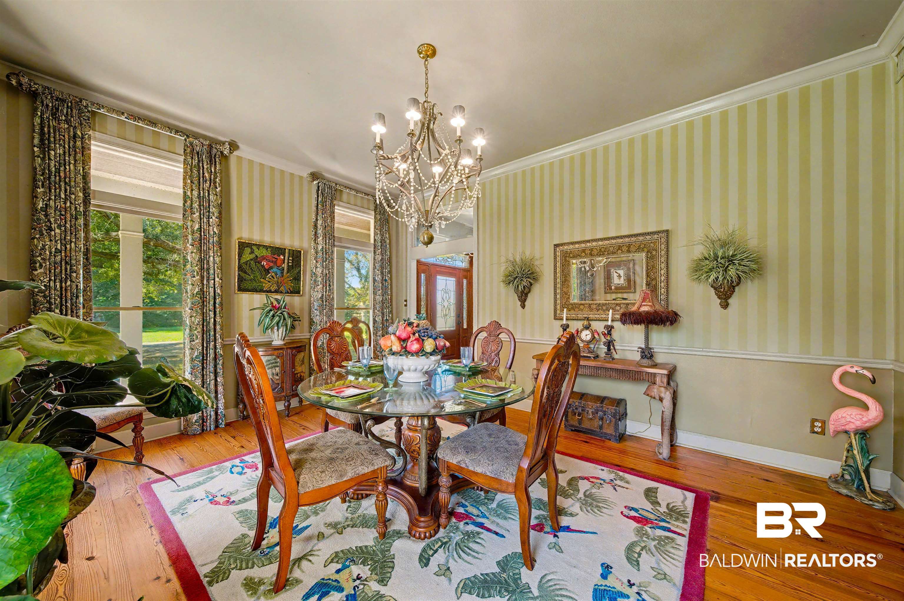 15810 County Road 73 Foley, AL 36535 - Photo 22 of 56 Dining space featuring ornamental molding, hardwood / wood-style floors, wallpapered walls, a wainscoted wall, and a chandelier