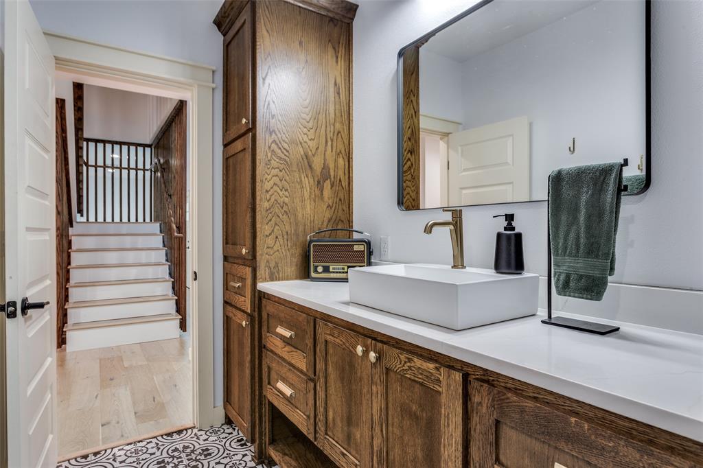 3120 Colcord Avenue Waco, TX 76707 - Photo 16 of 23 a bathroom with a sink and a mirror