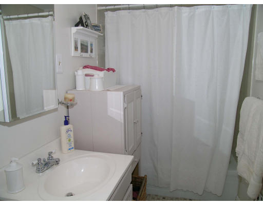 116 Sutherland Road, Unit 4 Boston, MA 02135 - Photo 8 of 8 a bathroom with a sink and vanity