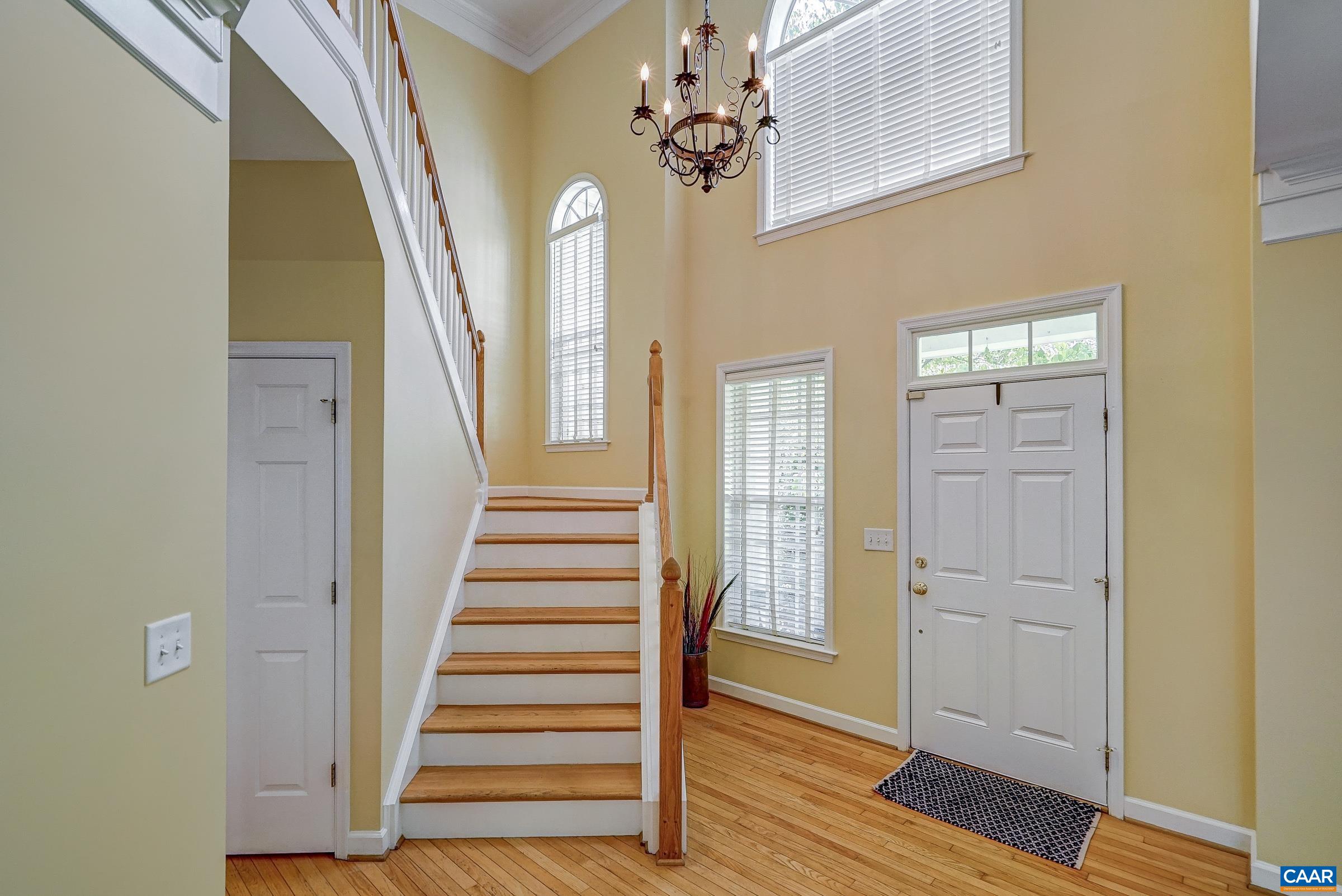 2050 Shepherds Ridge Road Charlottesville, VA 22901 - Photo 4 of 68 a view of a hallway with wooden floor and staircase