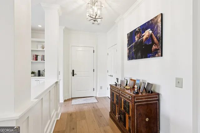 a living room with stainless steel appliances furniture a dining table and chairs
