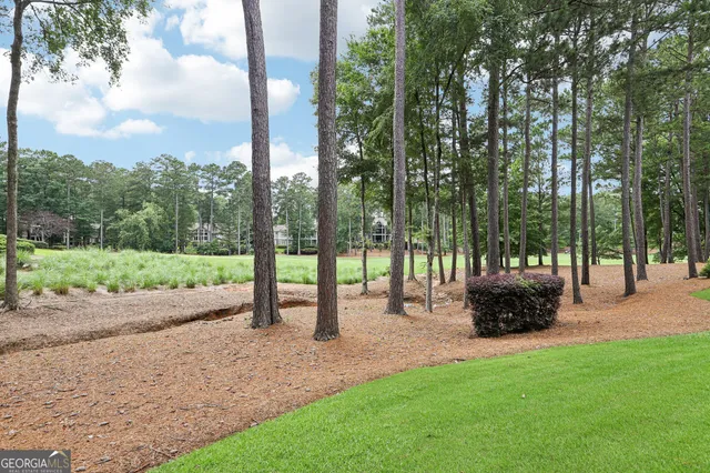 a front view of a multi story building with a yard