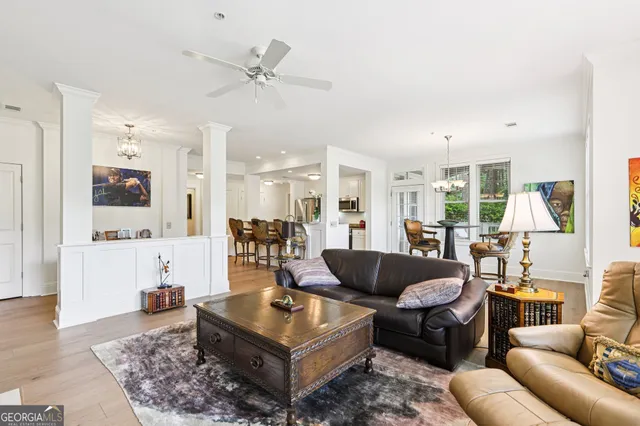a view of a dining room with furniture and a chandelier
