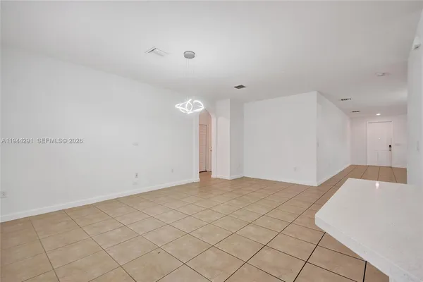 a view of a livingroom with furniture and a ceiling fan